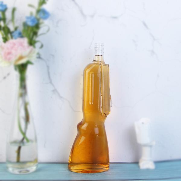 Botella de vidrio de whisky de 500 ml Con forma de pistola, molde abierto Botella de vodka de 700 ml para la industria de bebidas