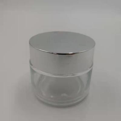 MSDS Clear 100g Glass Cream Jar With Shiny Silver Cap White Lid Mask Mud