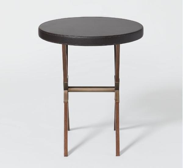 Antique brushed bronze metal base with upholstered leather top round hotel guestroom side table