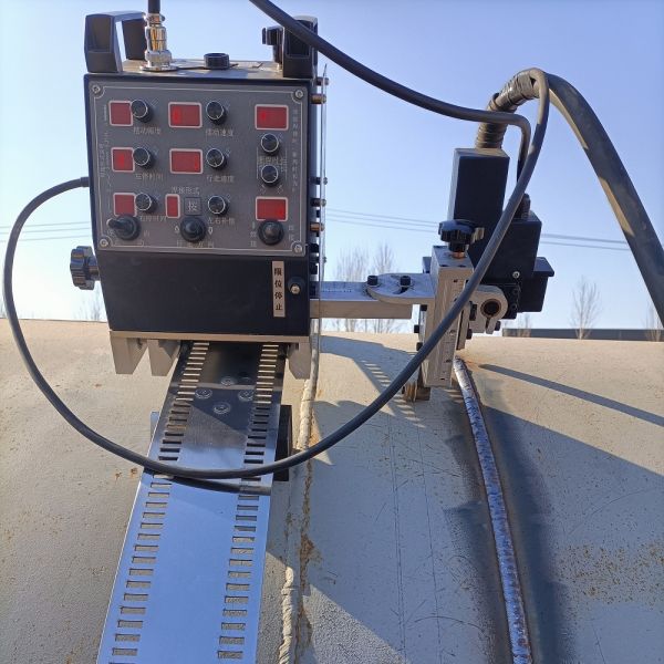 Tank Girth Welding Machine equipped with robot welding gun and integrated control reducing messy lines for and stable welding process