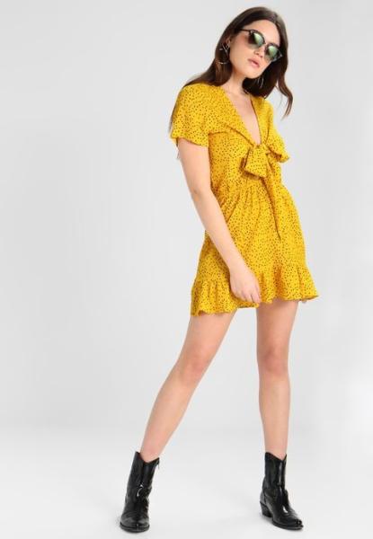 Mulheres amarelas sexy do vestido do às bolinhas do laço glamoroso do vestido do dia