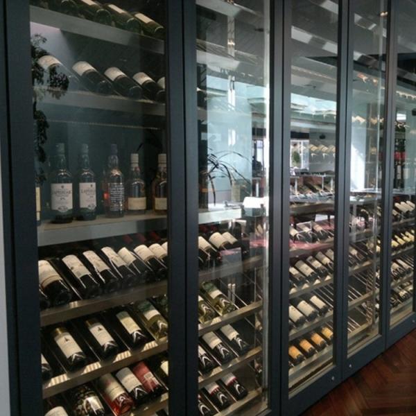 Black Metal Wine Cabinet Against The Wall Glass Door Bar Cabinet