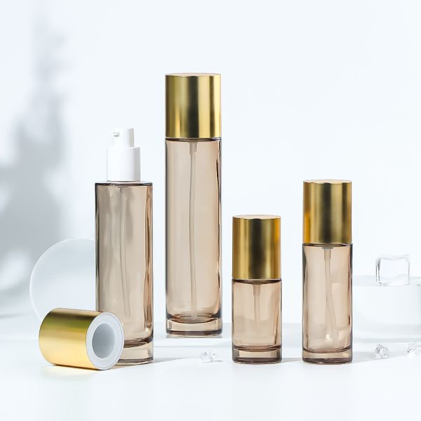 High-quality transparent glass cosmetic bottle with gradient paint and customized logo for lotion packaging