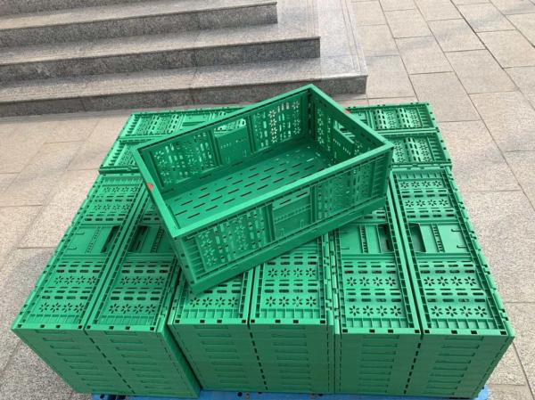 Versatile Orange Plastic Container for Organized and Secure Transportation of Produce