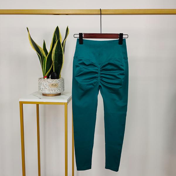 As calças sem emenda da ioga do elevador alto preto da extremidade de Waisted malham caneleiras do Scrunch