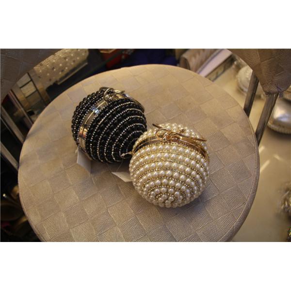 Round high-grade pearls evening bags woman holding a high-end fashion evening bag bride