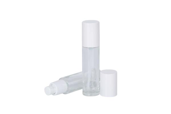 garrafa de vidro da fundação 30ml com a garrafa cosmética da essência da emulsão do curso da bomba de imprensa