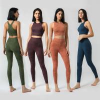 As mulheres o Activewear do Gym que da cobertura total ajusta a extremidade do impulso acima imprimiram caneleiras do Gym