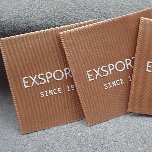 A tela que imprime o vestuário do silicone do cetim etiqueta 5*3cm para o Sportswear