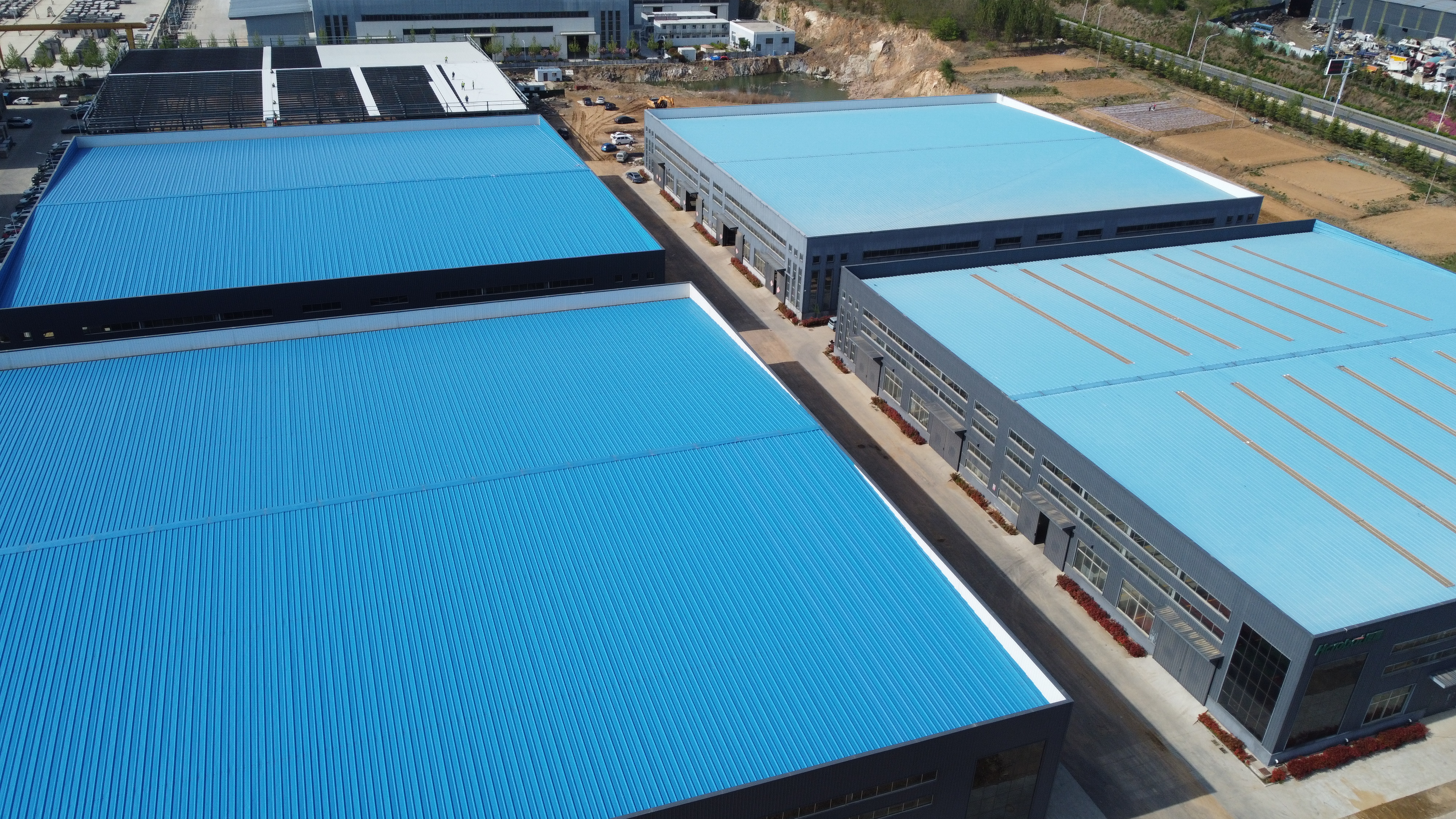Q235B Q355B ASTM A36 Prefab Steel Frame Building For Warehouse Workshop Custom Design