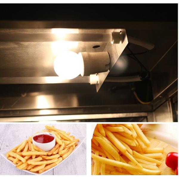 Оборудование ресторана фаст-фуда откалывает витрину грелки работника и картошки