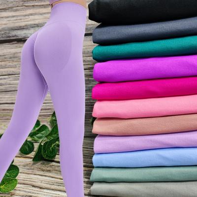 Uma ioga de levantamento anca de 11 senhoras das cores arfa as caneleiras sem emenda da extremidade do Scrunch respiráveis