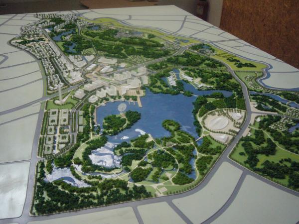 Architectural Model of Urban Master Plan with Green Landscape, Roads, and Mixed-Use Developments