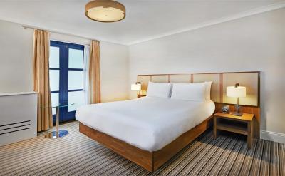 Budget Hotel Bedroom Furniture Leather bed with Leisure chairs and Wood TV Stand Cabinets