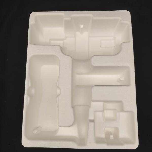 OEM manufacturers customize pulp molded packaging bases for small household appliance fascia guns. These are made of white plant fibers through dry pressing.