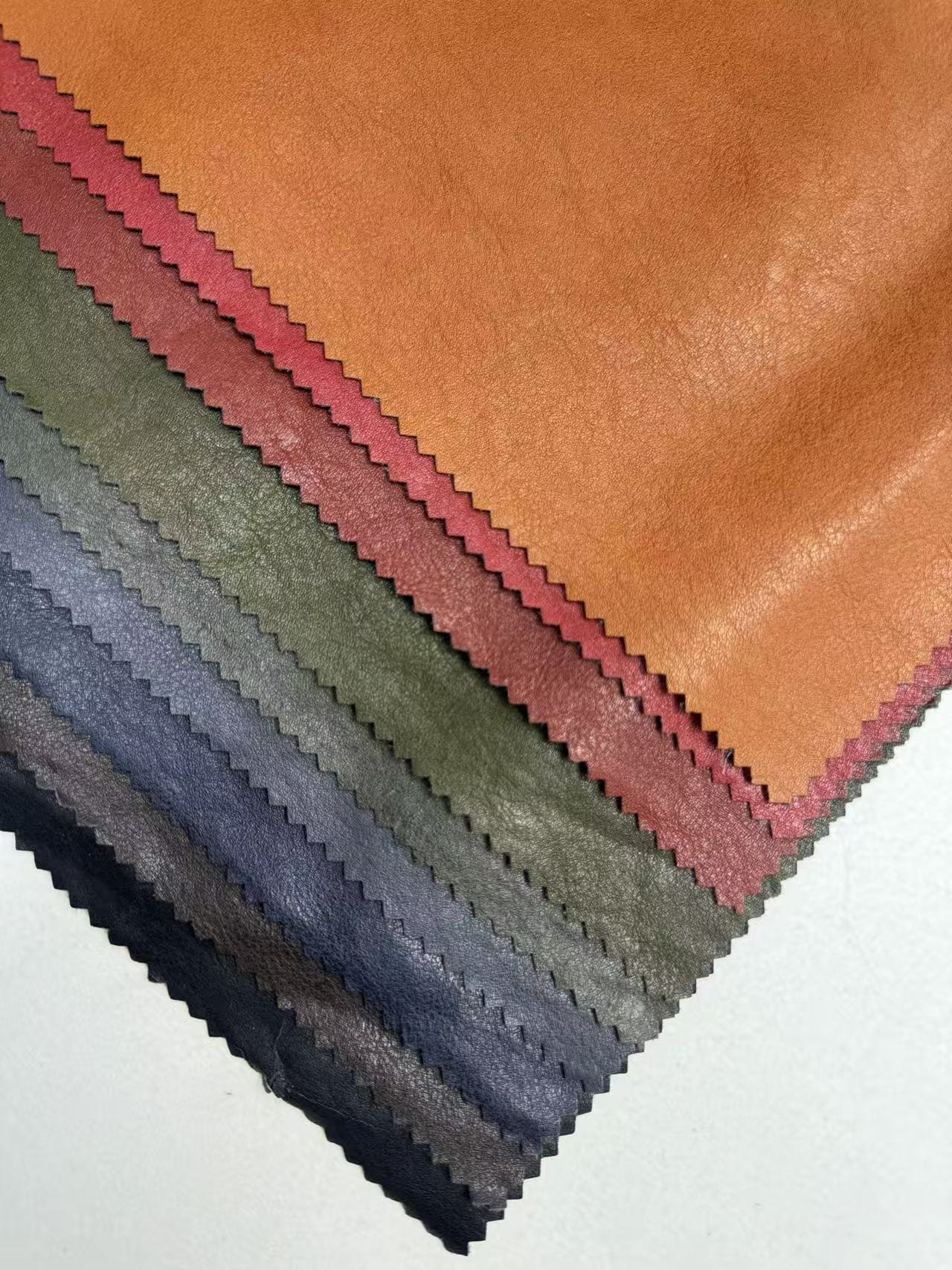 New Design Embossed PU Synthetic Waterproof Leather Fabric with Elastic for Garment Jacket Upholstery