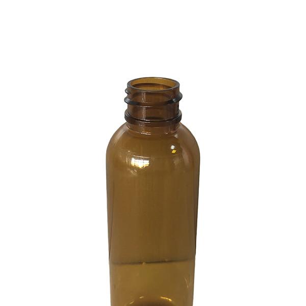 2 Oz Round Squeezable Clear Brown PET Bottle With Spray Pump 20/410