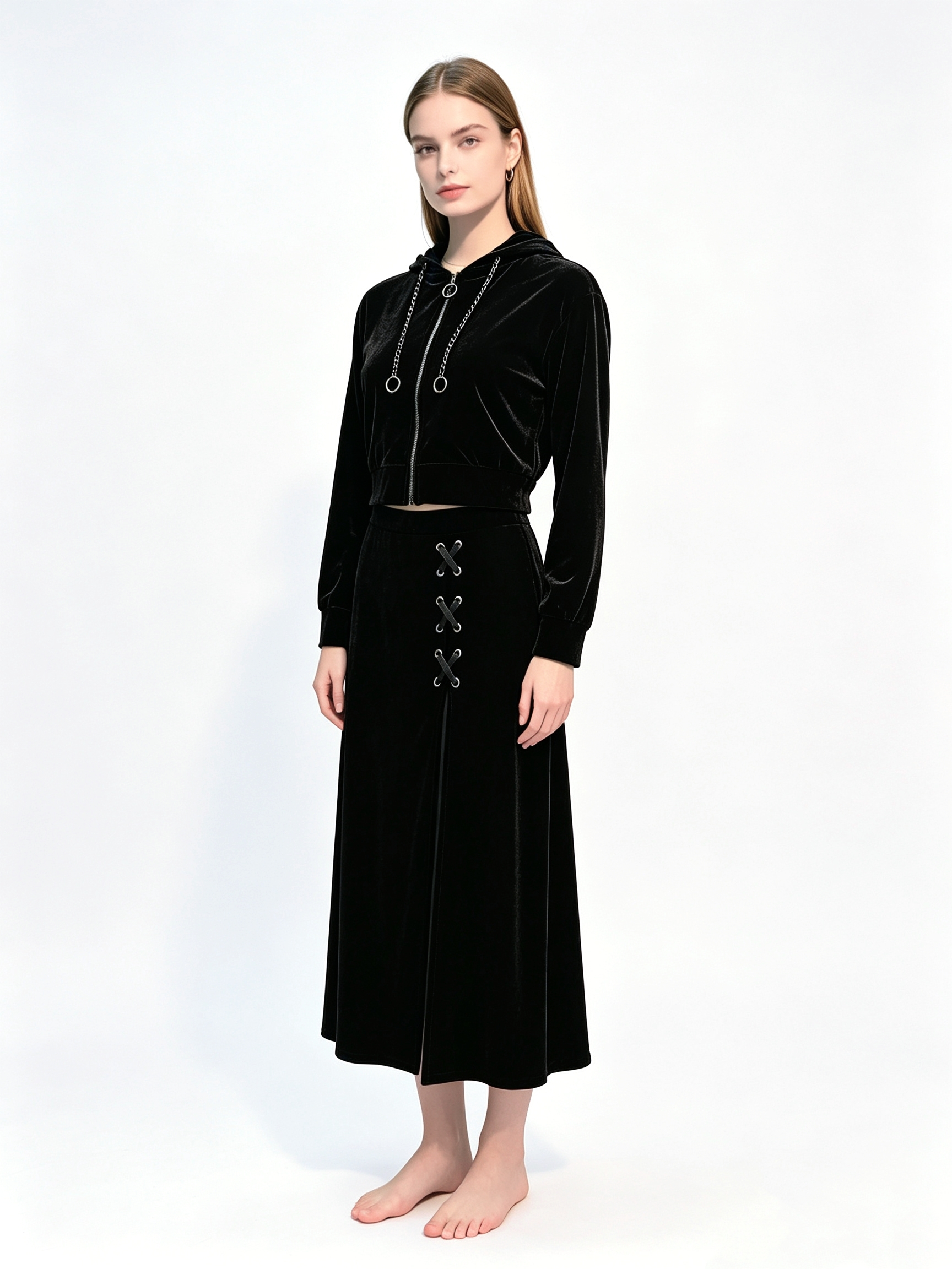 Black velvet two-piece set with cropped zip-up hoodie and flowy midi skirt