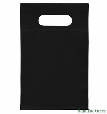 Os sacos de compras cortados impressos, cortaram sacos de plástico do punho para o presente