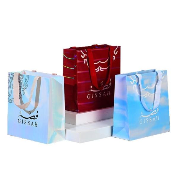 Sacs à main en carton blanc épaissis Sacs souvenirs personnalisés Magasin de vêtements Sacs cadeaux de vacances