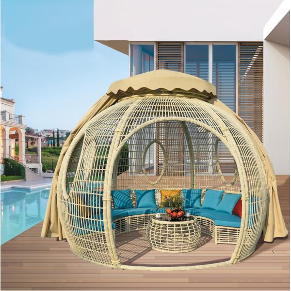 Transform Your Patio into a Relaxing Haven with a Rattan Daybed and Canopy