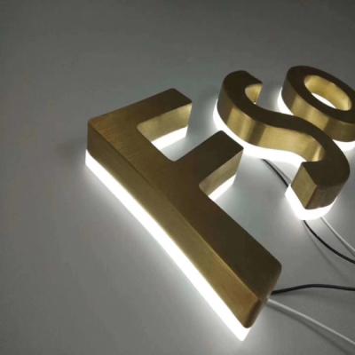 O ouro escova letras retroiluminadas de aço inoxidável do metal dos sinais
