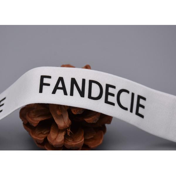 衣服は無光沢の黒いロゴと印刷されたゴムひもをカスタマイズした