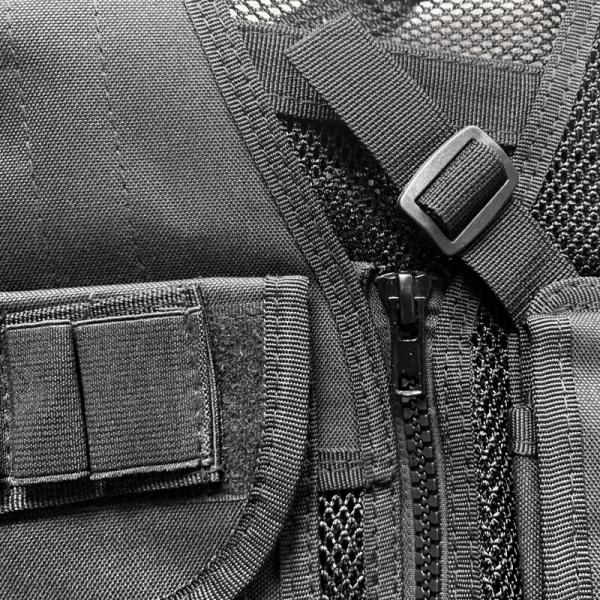 Veste noire de protection confortable avec plusieurs poches pour le corps et le tissu de l'équipement