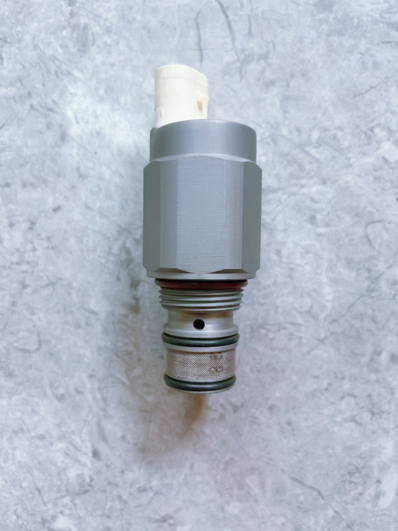 solenoid valve RE183407 used for JD5083E controlling hydraulic fluid flow and managing forward and reverse gear shifting