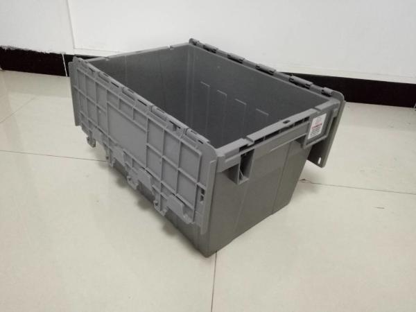 Yellow Plastic Storage Bins Attached Lids Stacked For Transportation
