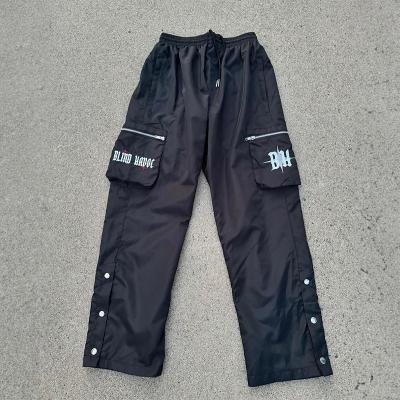 T-shirts en nylon personnalisé pour l' extérieur, pantalon de chargement, pantalon anti-vent, fermeture à glissière légère, pantalon de poche, pantalon de poche, bordure avec bouton au col
