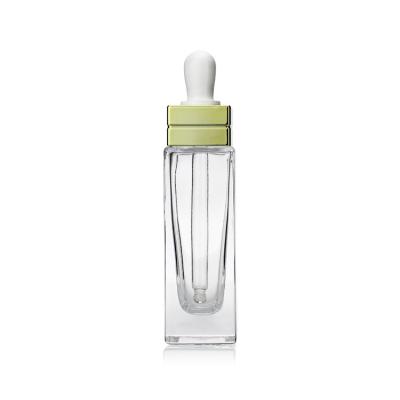 Os cosméticos 30ML luxuosos extravagantes esquadram a garrafa do soro do conta-gotas de olho da gota com a chegada nova S063 do tampão de prata