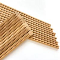 Os hashis de bambu descartáveis carbonizados personalizaram envolvido individualmente