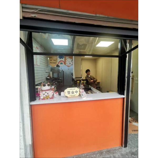 Wide-Format Folding Window Configuration Framing Mountain Vistas and Urban Skyline Views with Minimal Framework