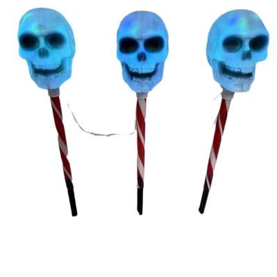 Red and white skull-shaped waterproof battery box socket lamp, one socket with three outlets, easy and simple to install, perfect for Halloween.