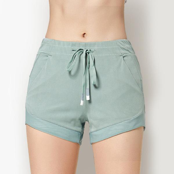 Short respirável de corrida da ioga do short de Custom Logo Women Anti Wrinkle Soft do fabricante da fábrica do Oem com bolsos