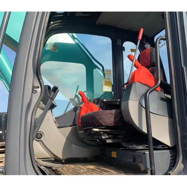 Excavateur Kobelco hydraulique SK210LC vert utilisé