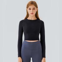 Dessus respirables de yoga de dames de séance d'entraînement de douille de pro peau les longs amincissent les chemises occasionnelles convenables
