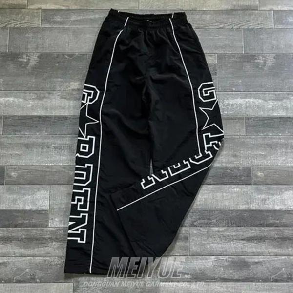 Coupe-vent personnalisé Pantalon léger en nylon Pantalon à tache Pantalon à large jambe Écran d'impression à rayures Pantalon à sueur pour hommes Pantalon à sac