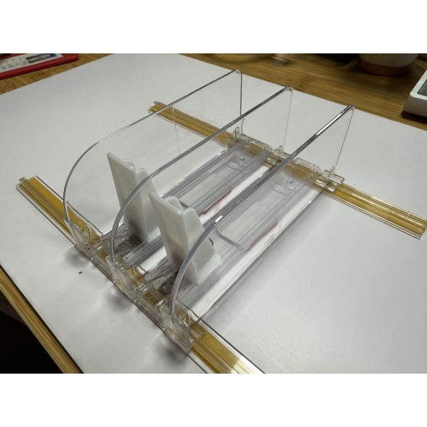 Upgrade Your Shelves with Our Spring-Loaded Shelf Pusher for Neat and Fully Stocked Displays