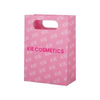Sacs en papier rose recyclables emballage cosmétique cadeau avec poignée de coupe sous pression
