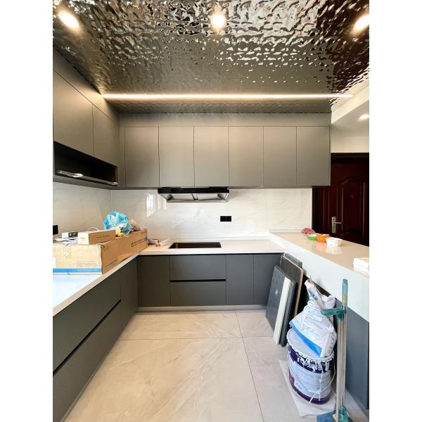 Modern High Gloss Kitchen Cabinets Featuring Elegant Stainless Steel Hardware