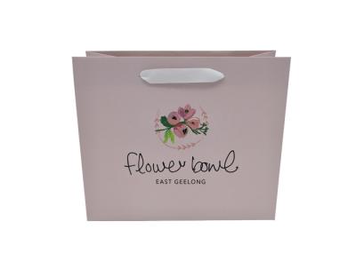 La coutume élégante de style de fleur a imprimé les sacs de papier personnalisés de cadeau avec des poignées