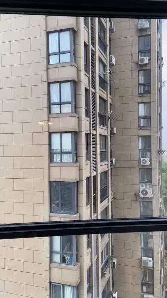 Urban Garden Folding Window Portal Enabling Safe Container Gardening Access in High-Rise Buildings
