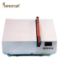 Machine de transfert de larves d'abeilles