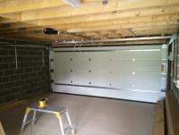 50 mm-80 mm porte de garage sectionnelle isolée résistance aux intempéries pour les commerces verticaux