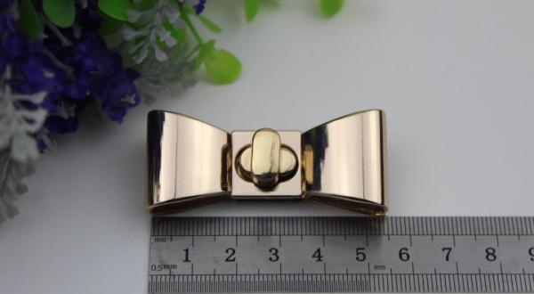 Hanging plating zinc alloy fashion gold metal bow-knot pattern small purse turn locks