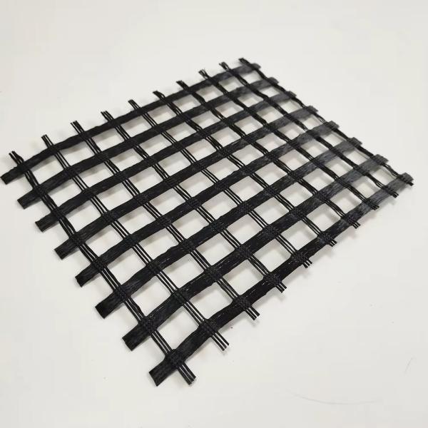 Asphalt Reinforcement 100KN Fiberglass Geogrid Mesh 25.4x25.4mm For Bitumen Road Surfaces