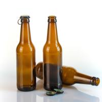 Vente en gros de verre vide 750ml 550ml 330ml Fabbrique de bouteilles de bière Transparente