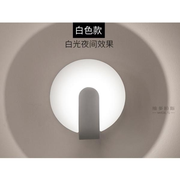 Modern simple and creative bedroom bedroom iron art wall lamp.